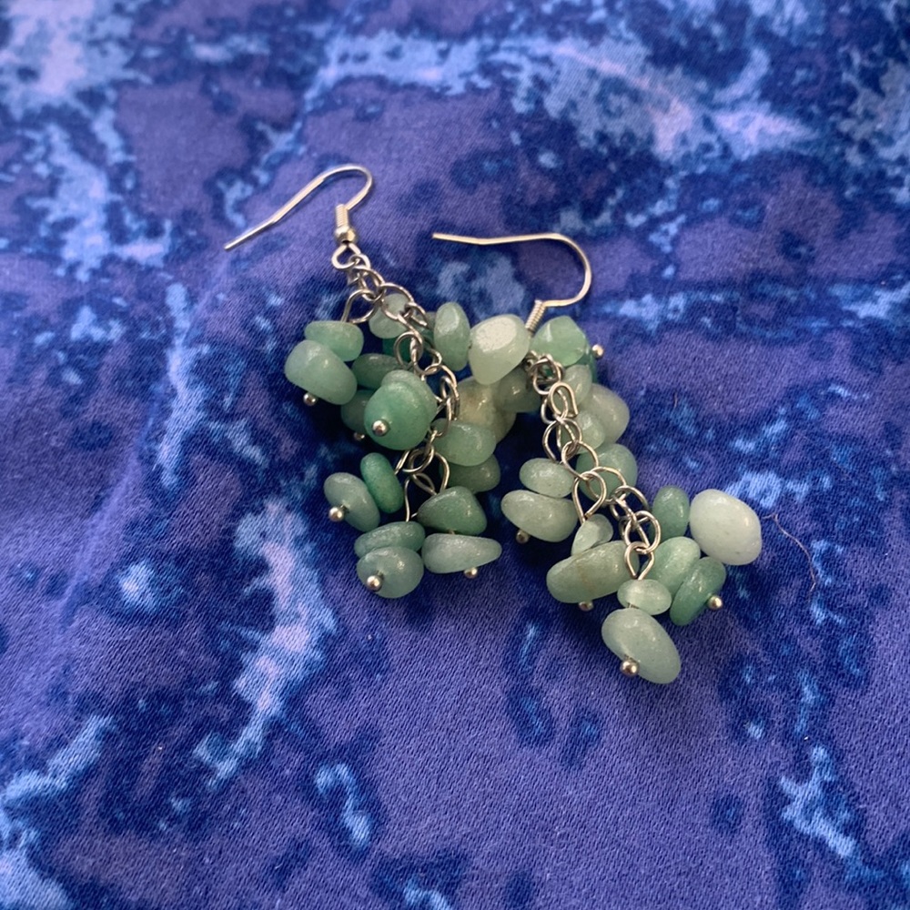 cute, green dangly earrings.